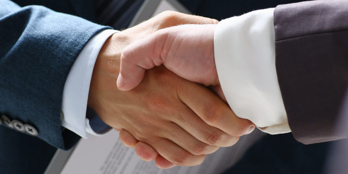 Man in suit shake hand as hello in office closeup. Friend welcome, mediation offer, positive introduction, greet or thanks gesture, summit participate approval, motivation, strike arm bargain concept